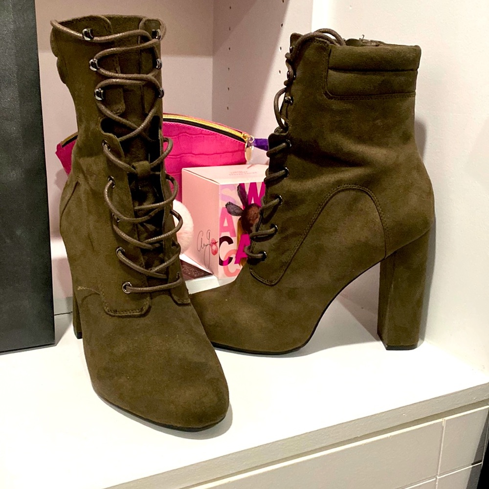 Brown suede lace up heel booties.
